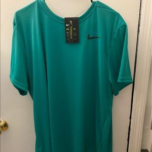 Nike Dri-Fit shirt in new condition with original tags.